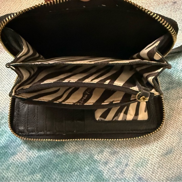 Women's Linea Pelle "Dylan" Zip Around Wallet in black soft leather. - Picture 4 of 7